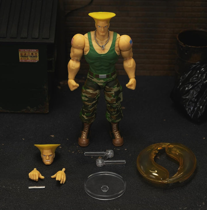 Jada Toys Street Fighter Figure Guile (15 Cm) - Personaj mobil de colecție și de acțiune din Street Fighter 2: The Final Challengers, cu cap, mâini și accesorii alternative, vârsta 13+